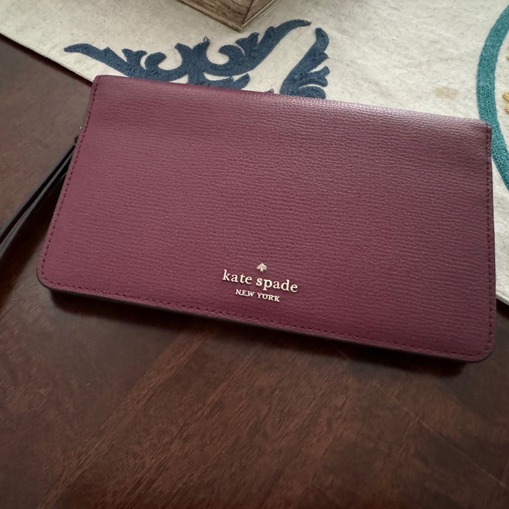 Beautiful Kate Spade plum wristlet/wallet. Brand New